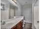 A full bathroom with a large mirror, vanity, and tile floors at 576 Bayo Canyon Ct, Henderson, NV 89015