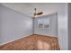A spacious bedroom with wood floors and a window provides natural light at 576 Bayo Canyon Ct, Henderson, NV 89015