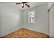 Bright bedroom featuring window with shuttered blinds and wood floors at 576 Bayo Canyon Ct, Henderson, NV 89015