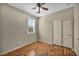 Bedroom featuring ceiling fan, closet with sliding doors, and window at 576 Bayo Canyon Ct, Henderson, NV 89015