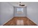 A cozy bedroom with wood floors and a bright window at 576 Bayo Canyon Ct, Henderson, NV 89015