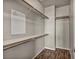 A walk-in closet with built-in shelves and clothing rods to maximize storage at 576 Bayo Canyon Ct, Henderson, NV 89015