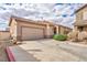 Charming single-story home featuring a tile roof, two-car garage, and well-maintained landscaping at 576 Bayo Canyon Ct, Henderson, NV 89015