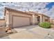 Charming single-story home featuring a tile roof, two-car garage, and well-maintained landscaping at 576 Bayo Canyon Ct, Henderson, NV 89015