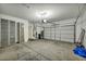 Spacious garage with storage cabinets and an automatic garage door at 576 Bayo Canyon Ct, Henderson, NV 89015