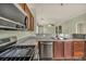 A modern kitchen with stainless steel appliances, granite countertops, and seamless integration with the living spaces at 576 Bayo Canyon Ct, Henderson, NV 89015