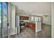 The open kitchen showcases stainless appliances, dark wood cabinets, and a seamless connection to the backyard at 576 Bayo Canyon Ct, Henderson, NV 89015