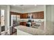 Kitchen featuring stainless steel appliances, granite countertops, and a breakfast bar at 576 Bayo Canyon Ct, Henderson, NV 89015