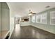 Open-concept living room flows into the kitchen, featuring tile floors and bright windows at 576 Bayo Canyon Ct, Henderson, NV 89015