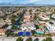 Detailed aerial view of the property showcasing its sports court, swimming pool, and verdant landscaping at 6214 Ebony Legends Ave, Las Vegas, NV 89131
