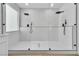 Luxurious walk-in shower features dual shower heads, marble tile, and modern glass enclosure at 6214 Ebony Legends Ave, Las Vegas, NV 89131