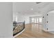 Second floor hallway view featuring wrought iron railing and ample natural light at 6214 Ebony Legends Ave, Las Vegas, NV 89131