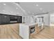Spacious open kitchen featuring an island, stainless steel appliances, and sleek, modern finishes at 6214 Ebony Legends Ave, Las Vegas, NV 89131