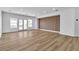 Open concept living area featuring recessed lighting, light colored wood flooring, and access to the backyard at 6214 Ebony Legends Ave, Las Vegas, NV 89131