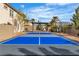 The property showcases a well-maintained sports court with a covered pergola and desert landscaping at 6214 Ebony Legends Ave, Las Vegas, NV 89131