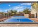 The property has a sports court featuring a basketball hoop and desert landscaping, perfect for outdoor activities at 6214 Ebony Legends Ave, Las Vegas, NV 89131