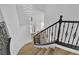 Elegant staircase featuring decorative iron railing and modern chandelier at 6214 Ebony Legends Ave, Las Vegas, NV 89131