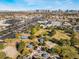 An aerial view highlights a park with covered picnic spots, a playground, and a sand volleyball court at 6250 W Flamingo Rd # 28, Las Vegas, NV 89103