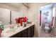 Bathroom with double sink vanity and an adjoining shower and toilet area at 6487 W Levi Ave, Las Vegas, NV 89141