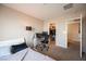 Cozy bedroom featuring a workspace and a well-organized closet at 6487 W Levi Ave, Las Vegas, NV 89141