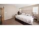 Cozy bedroom features carpet, natural light and queen bed at 6487 W Levi Ave, Las Vegas, NV 89141