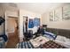 Bedroom with closet, artwork, and staircase access, offering comfort and style at 6487 W Levi Ave, Las Vegas, NV 89141