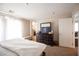Bright bedroom with a dresser, white walls, and neutral carpet at 6487 W Levi Ave, Las Vegas, NV 89141