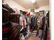 Walk in closet with many bags and clothes at 6487 W Levi Ave, Las Vegas, NV 89141