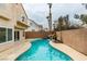 Backyard view showcasing a sparkling pool, patio area, and lush landscaping for relaxation and entertainment at 71 Sea Holly Way, Henderson, NV 89074