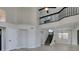 Bright living room featuring clerestory windows, staircase and second-story balcony at 71 Sea Holly Way, Henderson, NV 89074