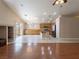 Spacious living area featuring wood floors, tile flooring and an open layout to the kitchen and dining area at 8034 Villa Armando St, Las Vegas, NV 89131