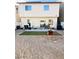 Backyard featuring gravel, artificial turf, patio, furniture and full privacy fence at 8036 Maple Park St, Las Vegas, NV 89131