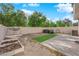 The backyard features gravel, grass, hot tub and garden at 8036 Maple Park St, Las Vegas, NV 89131