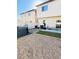 Backyard featuring gravel, artificial turf, and hot tub with privacy fence at 8036 Maple Park St, Las Vegas, NV 89131