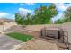 Private backyard with a hot tub, gravel and grass at 8036 Maple Park St, Las Vegas, NV 89131