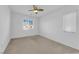 Bedroom featuring ceiling fan, window, and carpeted floor at 8036 Maple Park St, Las Vegas, NV 89131