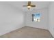 Bedroom featuring fan, window, and carpeted floor at 8036 Maple Park St, Las Vegas, NV 89131