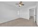 Clean bedroom with fan, closet, carpet, and window at 8036 Maple Park St, Las Vegas, NV 89131