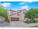 Two-story home featuring a two-car garage, driveway and lawn at 8036 Maple Park St, Las Vegas, NV 89131
