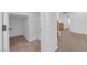 Bright hallway featuring a walk in closet and carpeted floor at 8036 Maple Park St, Las Vegas, NV 89131