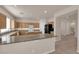 A spacious kitchen features granite counters, wood cabinets and stainless steel appliances at 8036 Maple Park St, Las Vegas, NV 89131