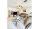 Comfortable living room with a ceiling fan, carpet, and media center at 8036 Maple Park St, Las Vegas, NV 89131