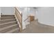 Staircase featuring carpeted steps and wooden handrail at 8036 Maple Park St, Las Vegas, NV 89131