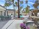 Spacious backyard featuring a serene fountain, comfortable seating, and mature landscaping at 8112 Golfers Oasis Dr, Las Vegas, NV 89149