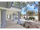 Expansive backyard with a covered patio, fountain, pool, and lush landscaping at 8112 Golfers Oasis Dr, Las Vegas, NV 89149