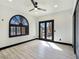 Bright bedroom features a ceiling fan, shutters and a French door entry to a courtyard at 8112 Golfers Oasis Dr, Las Vegas, NV 89149