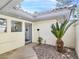 Private courtyard entrance with desert landscaping and modern architectural details at 8112 Golfers Oasis Dr, Las Vegas, NV 89149