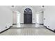 An elegant foyer features an arched entry, clean lines, and contemporary flooring at 8112 Golfers Oasis Dr, Las Vegas, NV 89149
