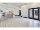 Open-concept living area showcases seamless flow to kitchen, featuring a bright and airy ambiance at 8112 Golfers Oasis Dr, Las Vegas, NV 89149