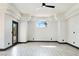 Spacious living room with ceiling fan and arched windows providing ample natural light at 8112 Golfers Oasis Dr, Las Vegas, NV 89149